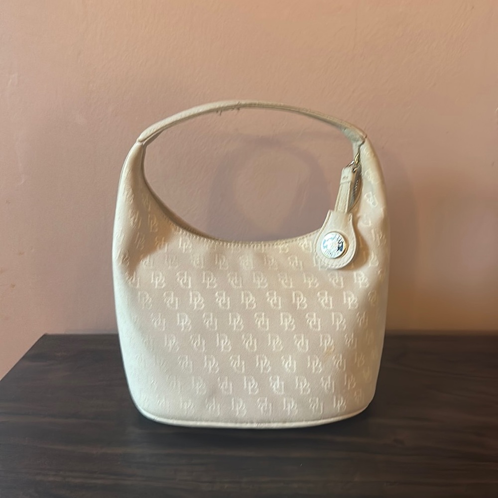 Dooney & Bourke Vintage Cream Bucket Small D&B Handbag .